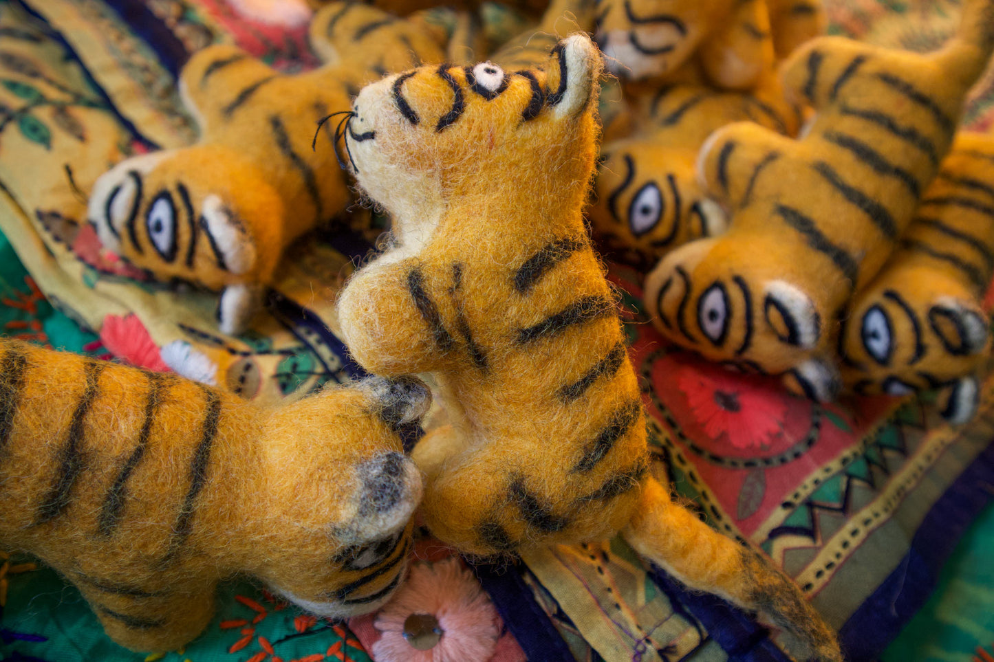 An ambush of felt tigers handmade in Nepal 🐯