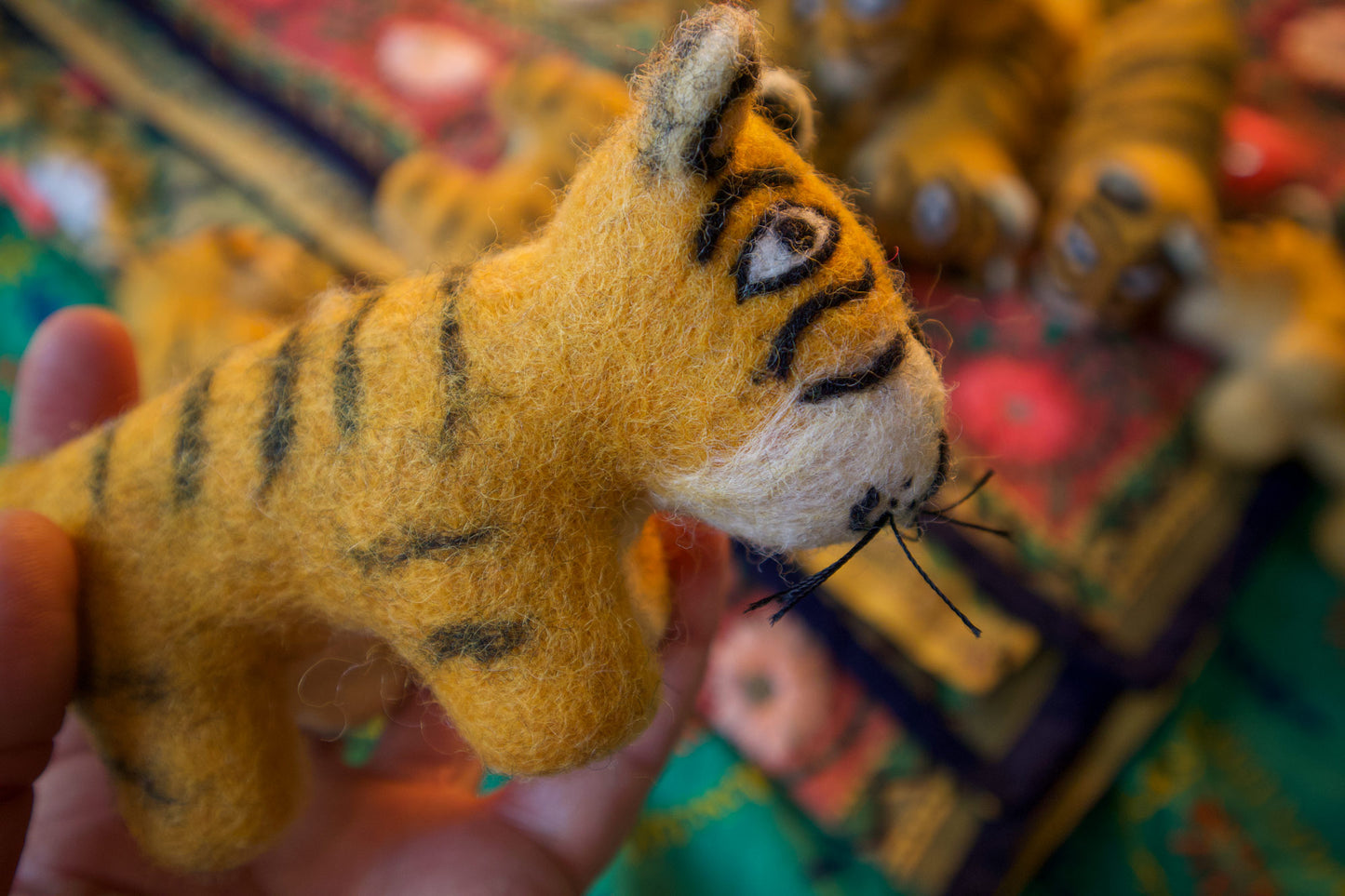 An ambush of felt tigers handmade in Nepal 🐯